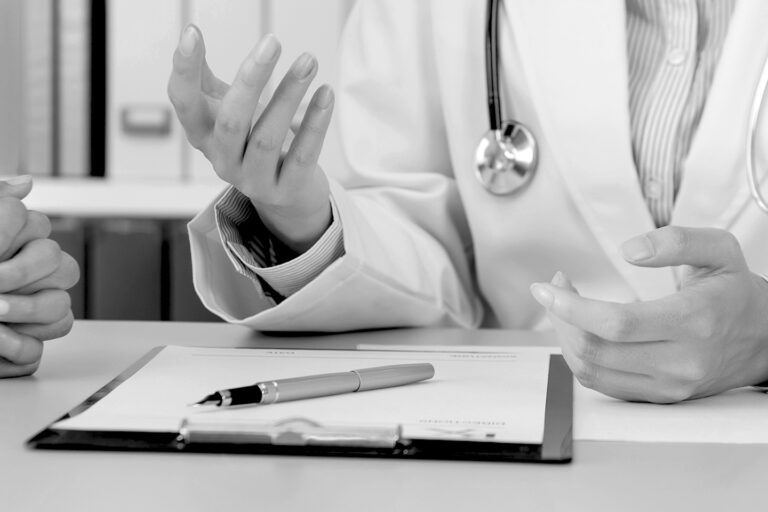 Medical Consultation - Doctor Discussing Diagnosis with Patient